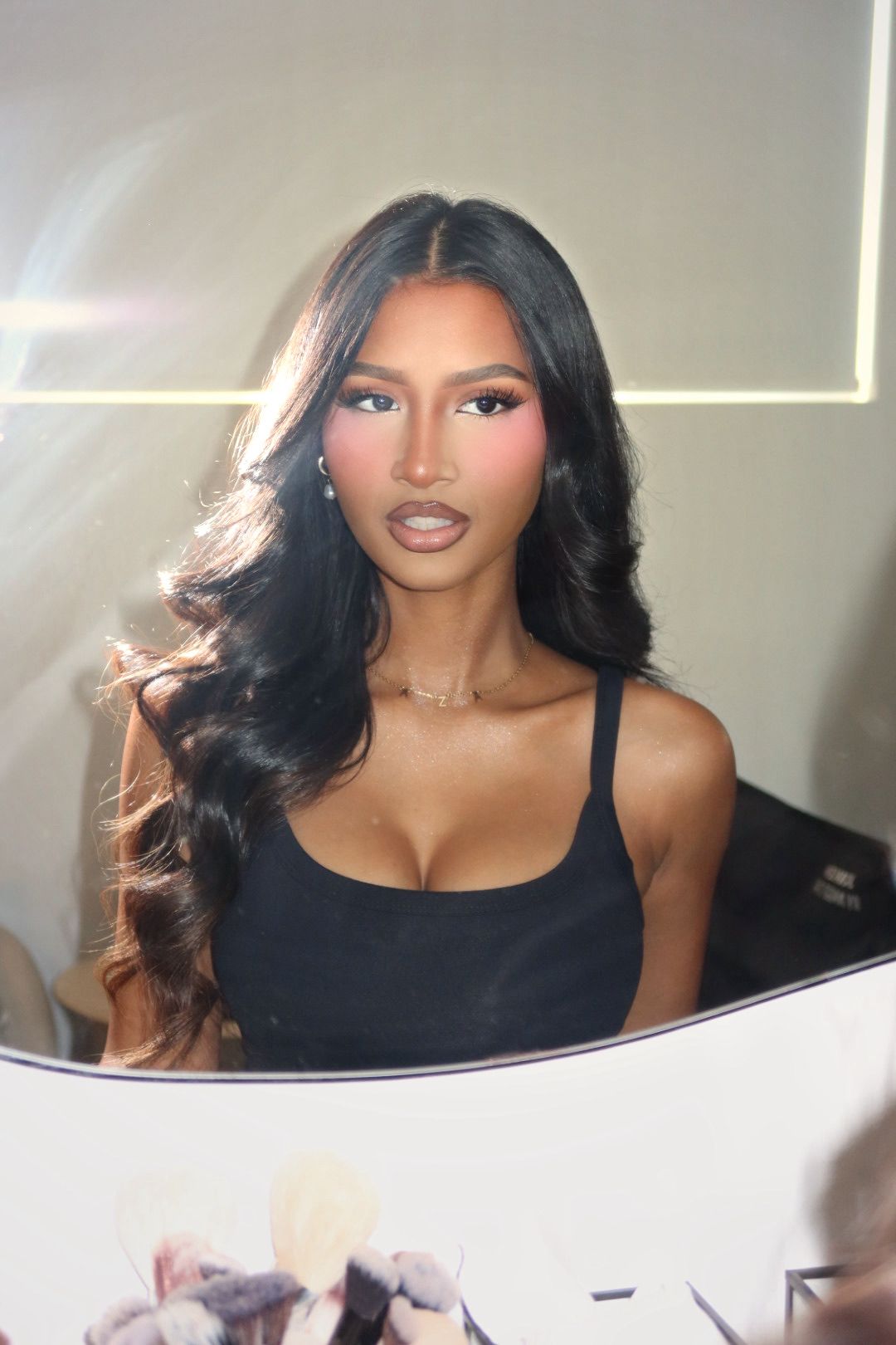Luminous soft glam with warm blush