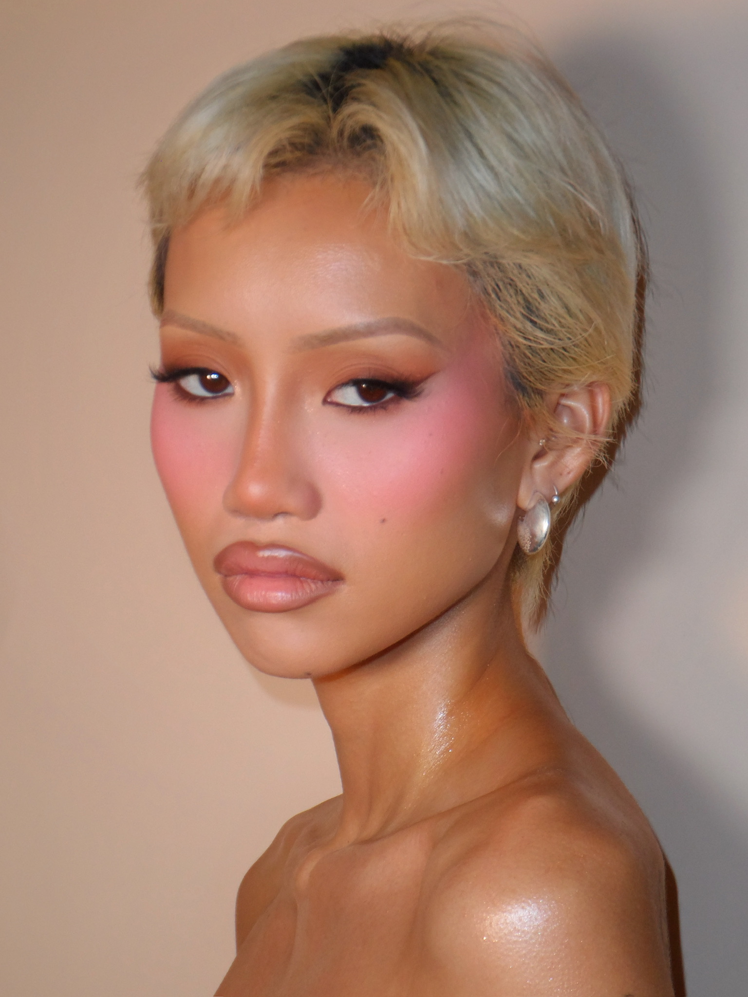 Soft glam with a blonde pixie and pink blush