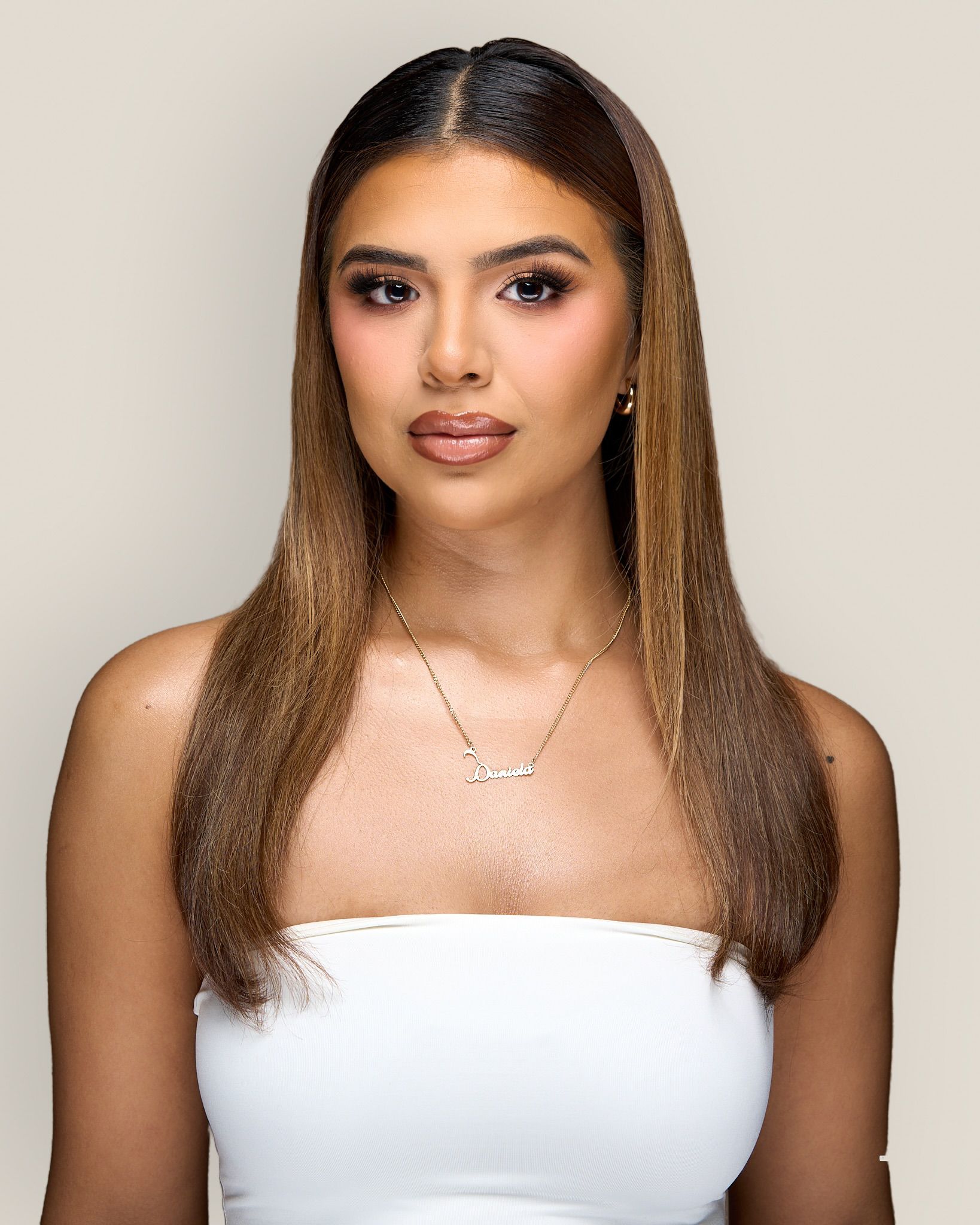 Soft, radiant bridal makeup in an airy studio